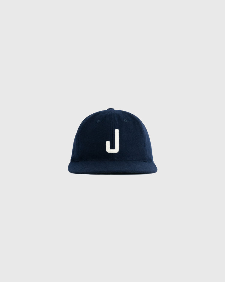 The EFF Joplin Miners 1950 Authentic Wool Ballcap, in navy with a white uppercase J on the front, is inspired by the style worn by Mickey Mantle and shown against a plain light gray background.