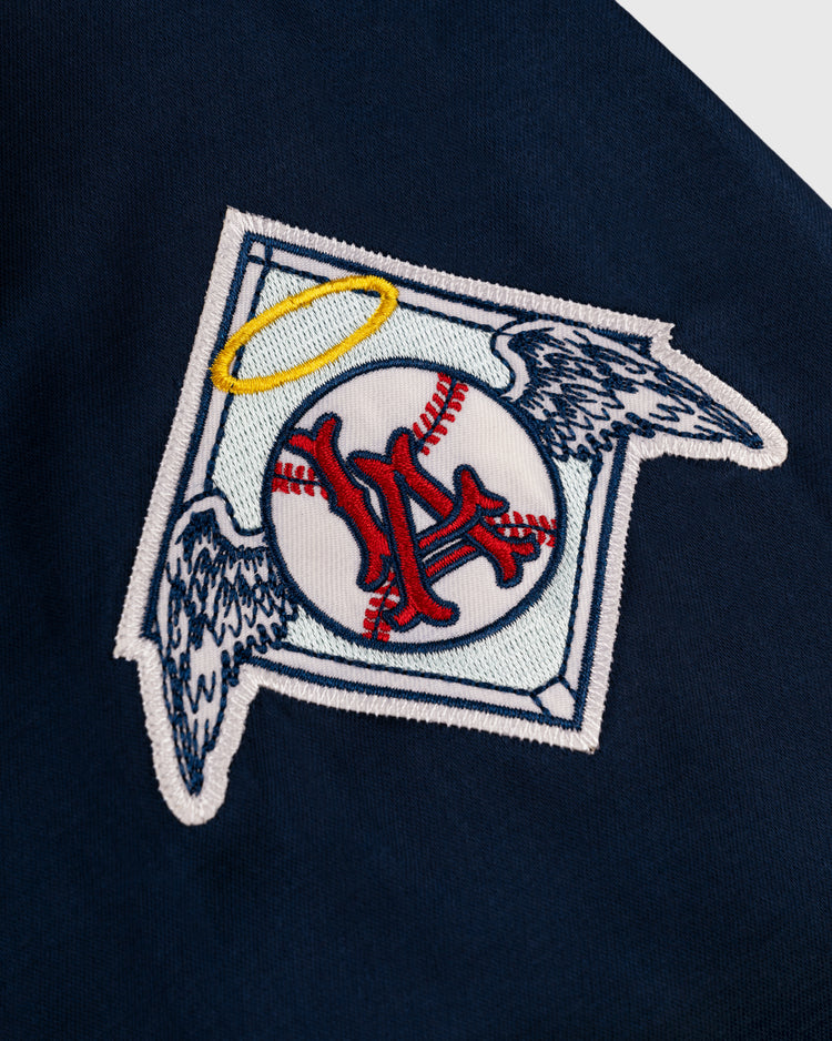 Show your team pride with this EFF Los Angeles Angels 1946 Satin Windbreaker Jacket, inspired by the iconic red-stitched NY baseball patch with a yellow halo and gray wings—perfect for vintage Pacific Coast League fans.