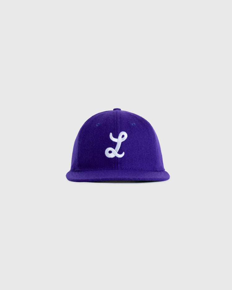 The EFF Louisiana State University 1957 Authentic Wool Ballcap is a vintage purple baseball cap with a white embroidered L on the front, faithfully reproducing the classic 1957 LSU design.