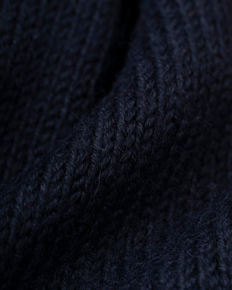 Close-up of the Washington Senators 1963-67 Wool Shawl Collar Sweater by Ebbets Field Flannels, featuring dark navy blue knit, thick textured yarn, and a detailed stitch pattern.