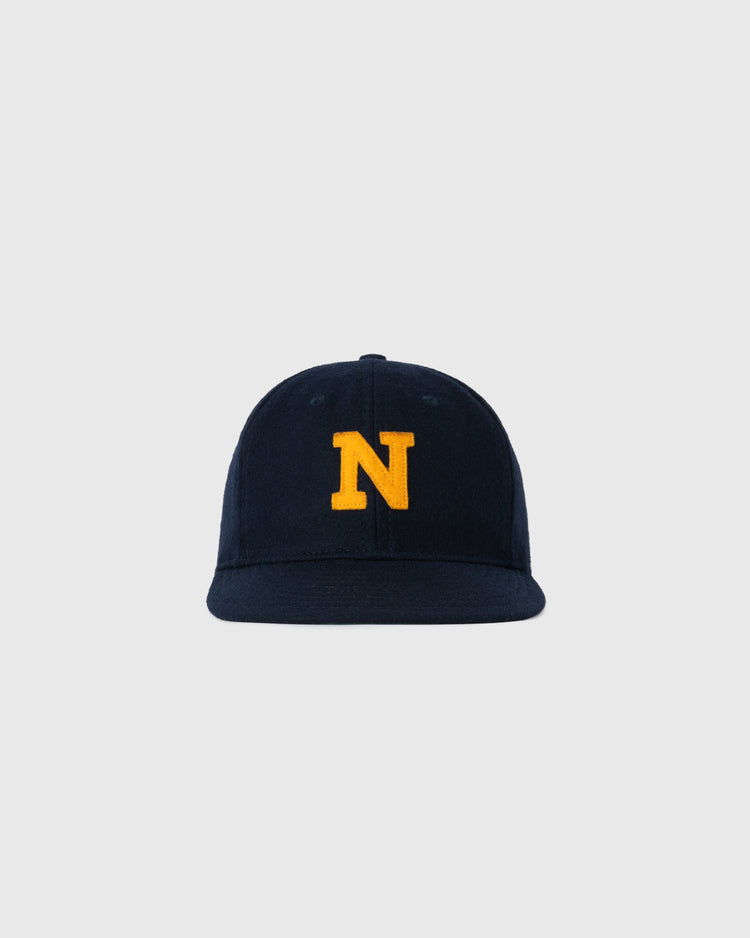 The EFF Navy 1928 Authentic Wool Ballcap features a yellow N embroidered on navy blue wool, inspired by the 1928 design, and is shown against a plain light gray background.
