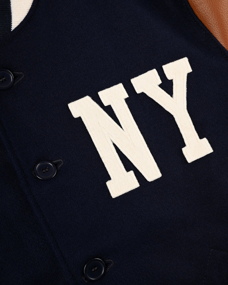 Close-up of the EFF New York Black Yankees 1940 Authentic Wool & Leather Varsity Jacket, with bold white NY letters on the chest, black buttons, and brown leather detailing—honoring Negro Leagues Baseball Museum heritage.