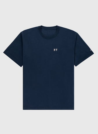The Ebbets Field New York Black Yankees Embroidered NY Short Sleeve Tee features small white NY text on a plain navy blue vintage-style shirt, inspired by the Black Yankees, laid flat on a light gray background.