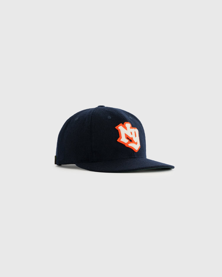 The EFF New York Knights 1939 Authentic Wool Ballcap from The Natural is shown in navy blue with an orange and white embroidered logo on the front, displayed against a plain light grey background.