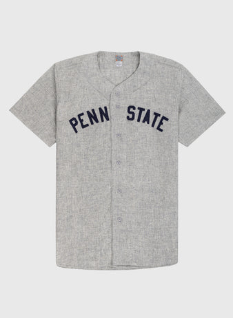 The Ebbets Field Penn State University 1955 Authentic Wool Road Baseball Jersey is a gray short-sleeve button-up featuring PENN STATE in large navy letters, inspired by the 1955 Nittany Lions, shown on a plain white background.
