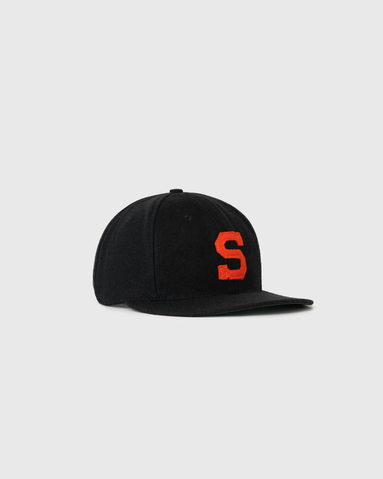 The EFF San Diego Padres (PCL) Authentic Wool Ballcap is a black flat-brim cap with a large red S embroidered on the front, inspired by classic styles and shown against a light gray background.