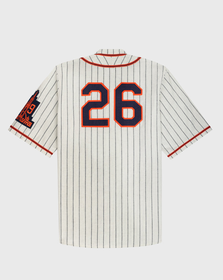 The Ebbets Field San Francisco Seals 1938 Authentic Wool Home Baseball Jersey features white flannel with thin black stripes, red trim, blue/red #26 on back, and a blue/red patch on the left sleeve—a faithful classic reproduction.