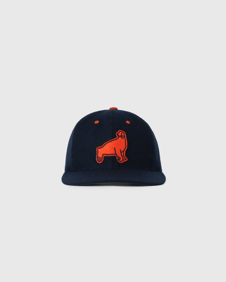 The EFF San Francisco Seals 1940 Authentic Wool Ballcap features a navy base with an orange embroidered upright gorilla on the front, inspired by Pacific Coast League history, shown on a light gray background.
