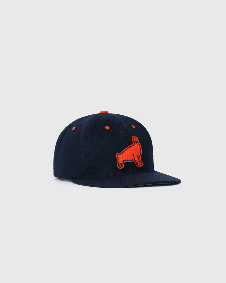 The EFF San Francisco Seals 1940 Authentic Wool Ballcap is a navy blue cap with a flat brim, orange eyelets, and an embroidered orange dog logo on the front, shown on a plain light background.