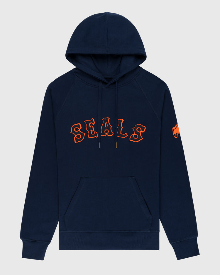 The EFF San Francisco Seals Cotton French Terry Pullover Hoodie features a navy blue design, front pocket, drawstring hood, bold orange-outlined SEALS print across the chest, and an orange patch on the left sleeve.