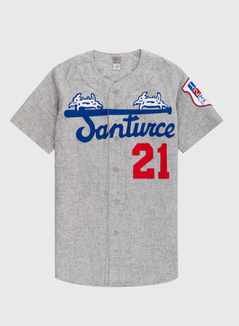 The Ebbets Field Santurce Cangrejeros 1954 Authentic Wool Road Baseball Jersey features Santurce in blue script, two white crabs, a blue bat, red 21 on the front, and a left sleeve patch—honoring Roberto Clemente.
