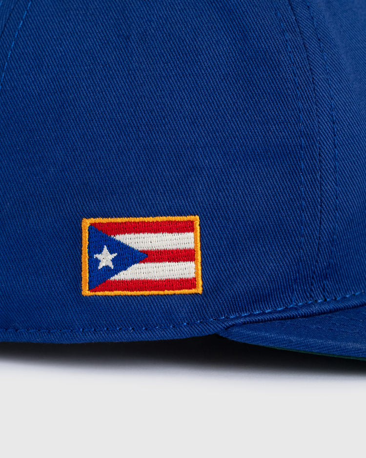 A close-up of the Ebbets Field Santurce Cangrejeros Cotton Twill Ballcap with an embroidered Puerto Rican flag patch on the side, honoring Puerto Rican baseball heritage.