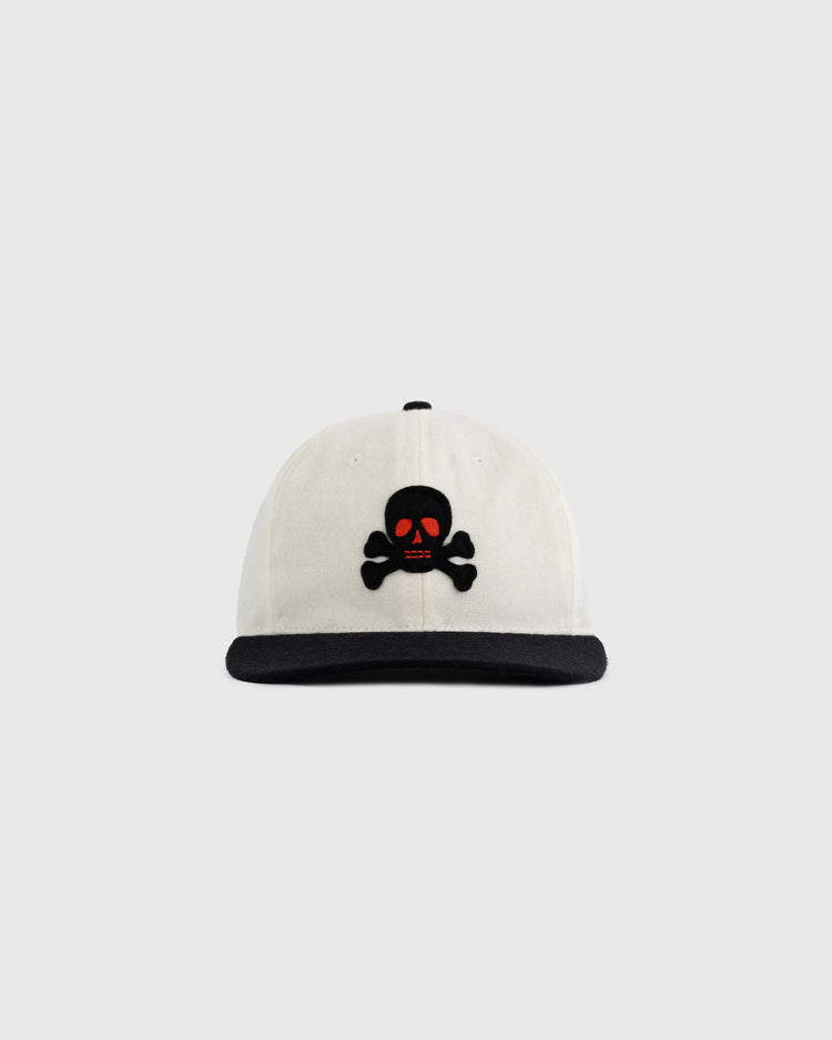 The EFF Sioux City Ghosts Two Tone Vintage Inspired Wool Ballcap is a white cap with a black brim, featuring a black skull and crossbones with red eyes embroidered on the front, shown against a plain light gray background.