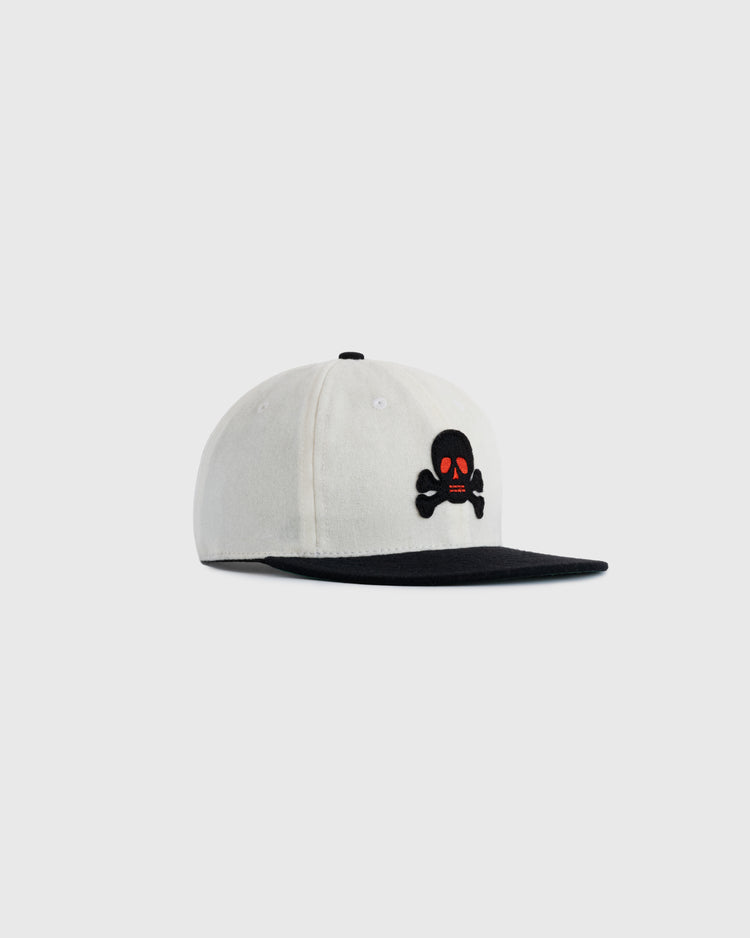 The EFF Sioux City Ghosts Two Tone Vintage Inspired Wool Ballcap features a white crown, black brim, and a front black skull and crossbones design with red eyes and nose, shown on a plain light background.