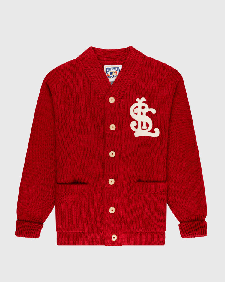 The EFF St. Louis Cardinals 1908 Wool Shawl Collar Sweater is a red cardigan featuring tan buttons, two front pockets, and a large white SLC chest patch—a faithful reproduction of the classic 1908 Cardinals sweater.