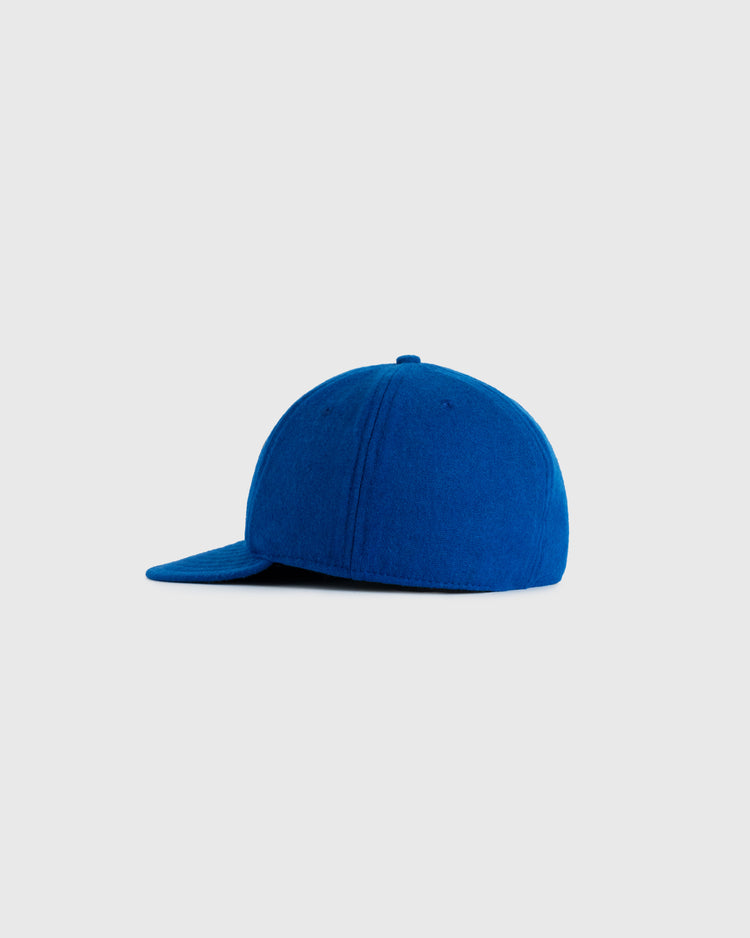 The EFF Stewart-Warner 1930 Authentic Wool Softbrim Ballcap is shown from the side in royal blue against a light gray background.