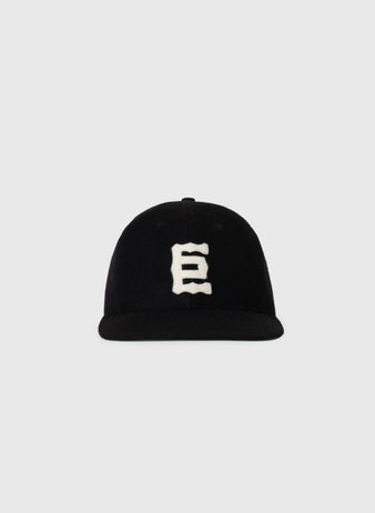 The EFF Tokyo Kyojin (Giants) 1940 Authentic Wool Softbrim Ballcap is black with a white stylized “E” on the front, inspired by the Tokyo Giants and shown against a plain light gray background.