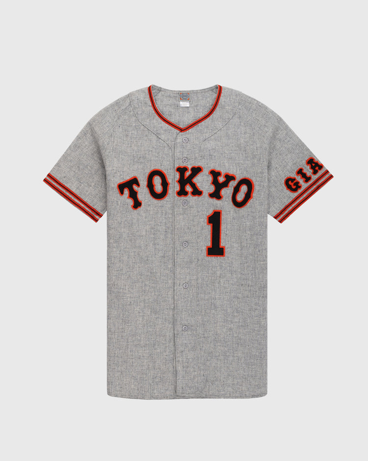 The Ebbets Field Flannels Tokyo Kyojin (Giants) 1961 Authentic Wool Road Baseball Jersey features gray wool, TOKYO and #1 in black/red, striped sleeve trim, and G.I.A. patch—faithful to the classic 1961 Giants design.