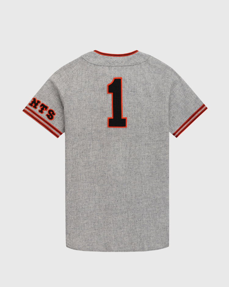 The Ebbets Field Flannels Tokyo Kyojin (Giants) 1961 Authentic Wool Road Baseball Jersey features gray wool, red and black sleeve stripes, NTS on the left sleeve, and #1 on the back, inspired by Sadaharu Oh’s classic Tokyo Giants jersey.