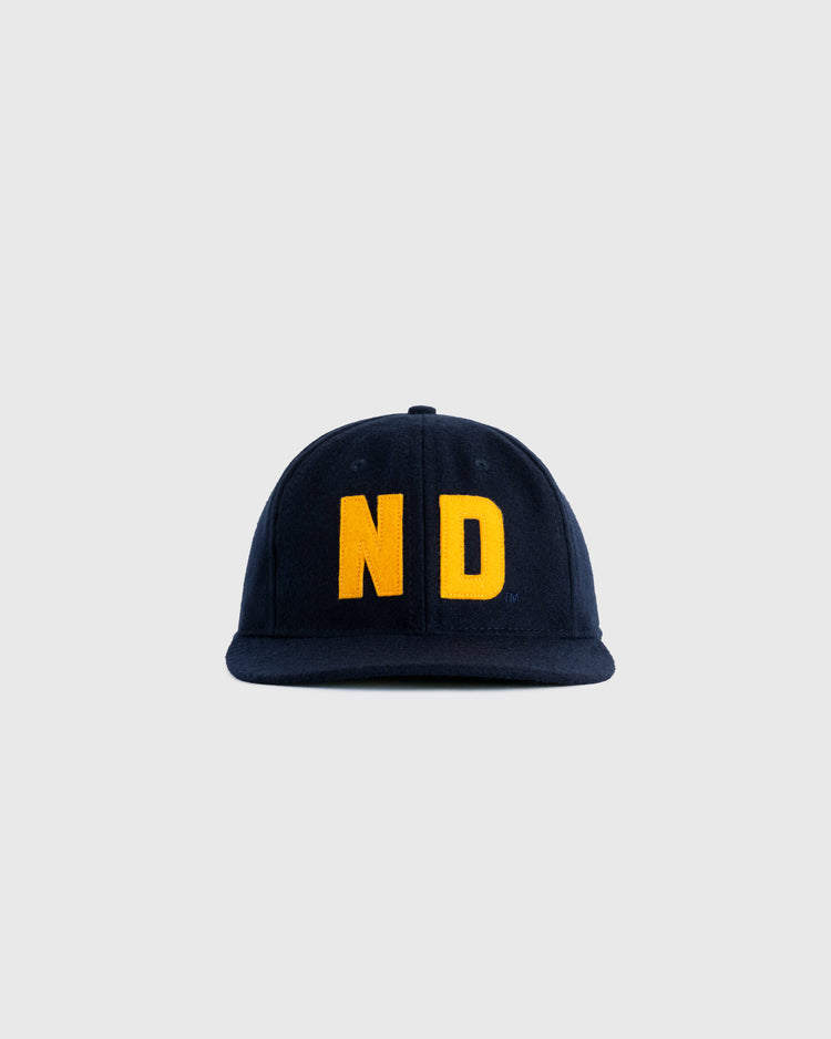 The EFF University of Notre Dame 1966 Authentic Wool Ballcap in navy features large yellow ND letters on the front, shown against a light gray background.