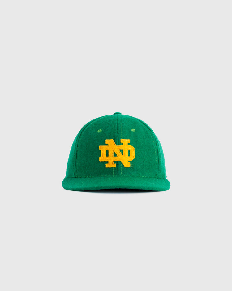 The EFF University of Notre Dame ND Authentic Wool Ballcap features a green wool design with a yellow “ND” logo embroidered on the front, shown against a plain light gray background.