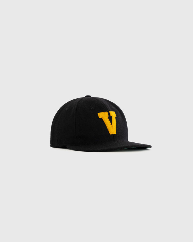 The EFF Vanderbilt University 1960 Authentic Wool Ballcap is a black cap with a yellow V on the front, inspired by Vanderbilt Commodores style and shown against a light gray background.