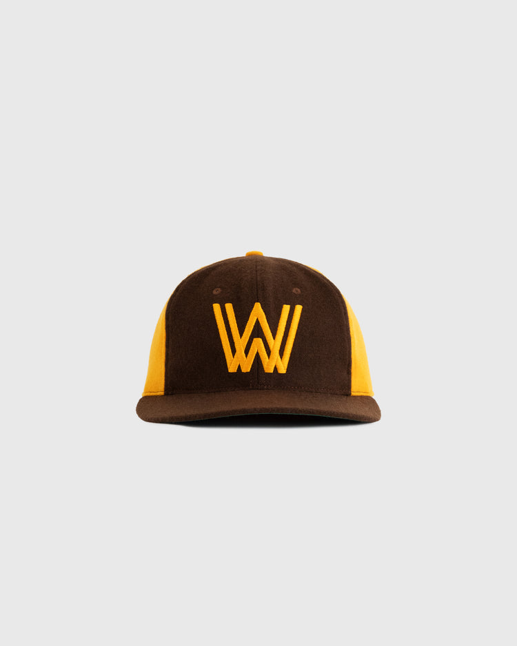 The EFF Walla Walla Padres 1974 Authentic Wool Ballcap features a brown and yellow design with a bold yellow “W” logo, replicating the original Northwest League style, shown against a plain light gray background.
