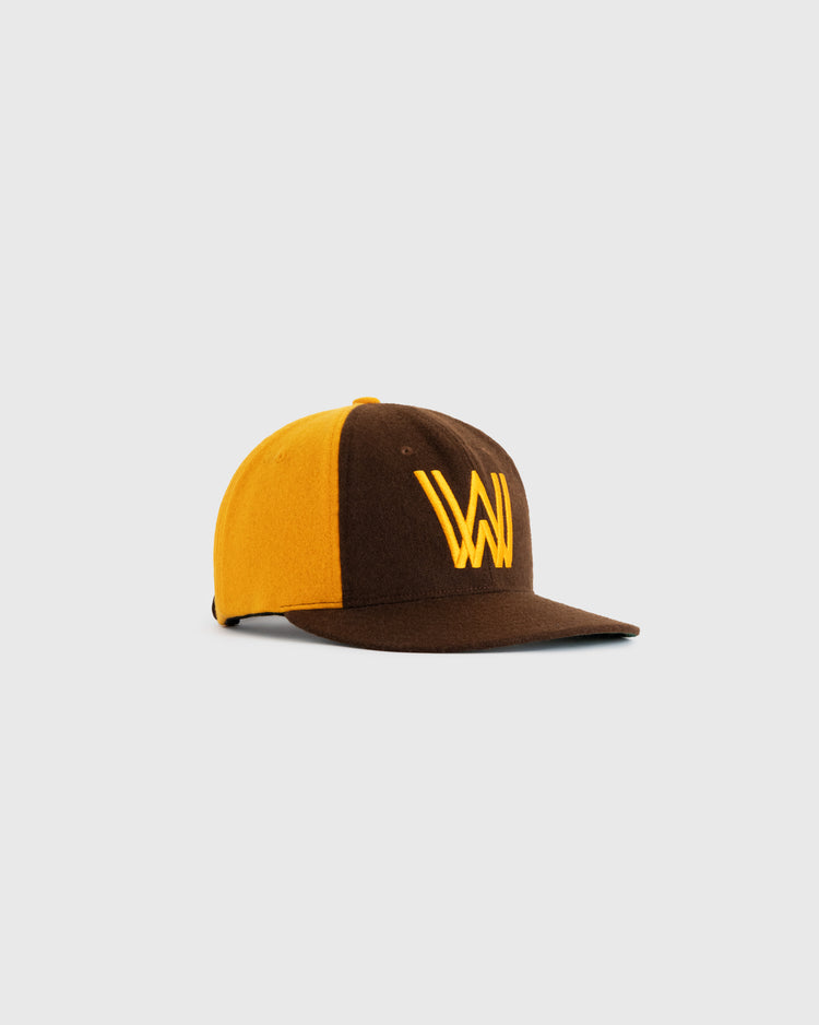 The EFF Walla Walla Padres 1974 Authentic Wool Ballcap features brown and yellow wool with a yellow W embroidered on the front, celebrating classic Northwest League style. Displayed against a plain white background.