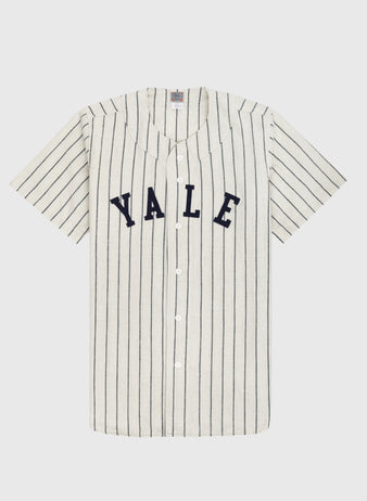 The Ebbets Field Yale University 1948 Authentic Wool Home Baseball Jersey is vintage-style, white with thin black stripes, short sleeves, bold navy YALE lettering on the chest, and classic white front buttons.