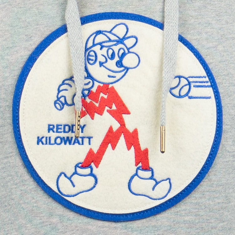 The EFF Reddy Kilowatt French Terry Script Hooded Sweatshirt in gray features a circular patch of Reddy Kilowatt with red lightning bolts, blue outline, hat, and baton. REDDY KILOWATT is on the left; two gray drawstrings hang over the patch.
