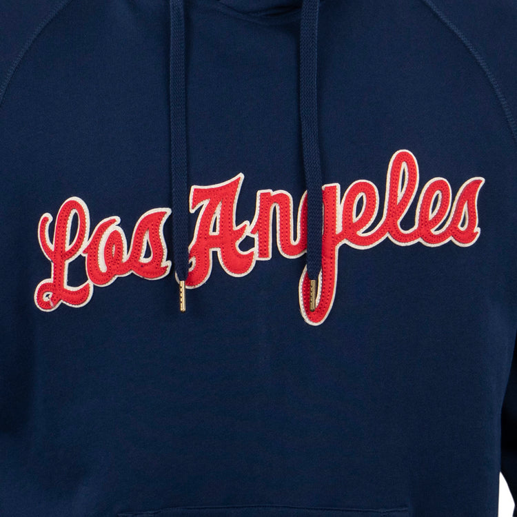 Close-up of the EFF Los Angeles (PCL) French Terry Script Hooded Sweatshirt in navy with Los Angeles in red cursive outlined in white—a tribute to the Angels and iconic moments like the 1942 PCL playoffs.