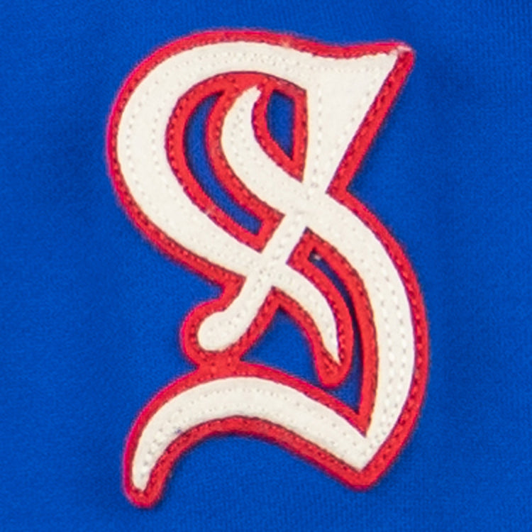 The EFF Santurce Cangrejeros French Terry Script Hooded Sweatshirt in royal blue features a white and red embroidered interlocking S and L logo, inspired by the vibrant style of the Puerto Rican League.