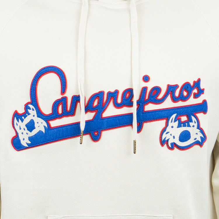Close-up of the EFF Santurce Cangrejeros French Terry Script Hooded Sweatshirt in natural, showing Cangrejeros in blue and red script, flanked by two blue-and-white crabs and a bat. White drawstrings sit above the design.