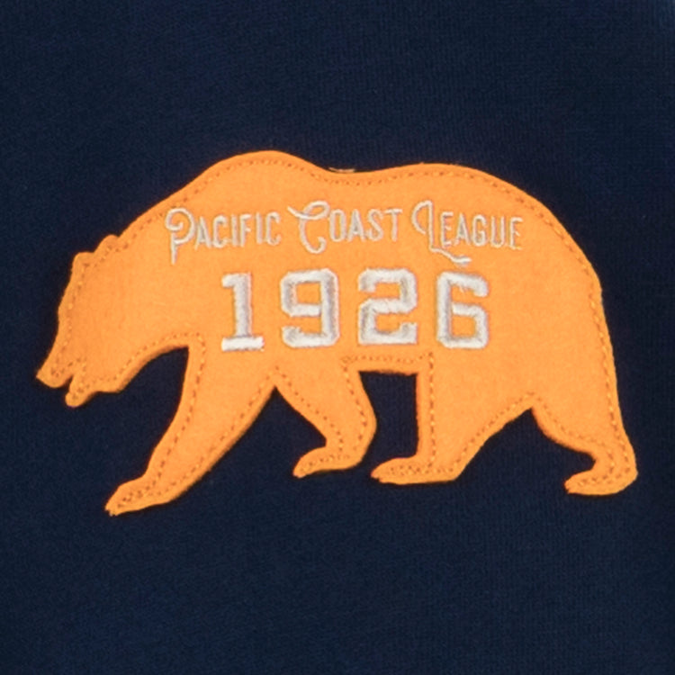 The EFF Mission Bears French Terry Script Hooded Sweatshirt features Pacific Coast League and 1926 embroidered in white on a dark blue background, honoring teams like the Mission Bears.