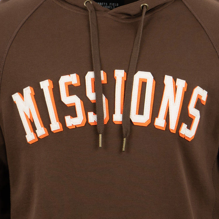 The EFF San Antonio Missions French Terry Script Hooded Sweatshirt features MISSIONS in bold white-and-orange script on a brown base, inspired by San Antonio baseball and the Texas League, with two brown drawstrings.