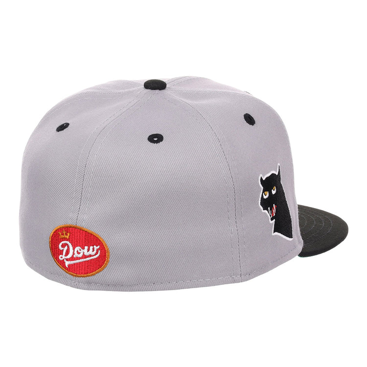 The EFF Montreal Black Panthers NLB Flip Fitted Ballcap in gray features a black brim, side panther head graphic, and a red oval Dow patch on the back, blending vintage inspiration with standout details.