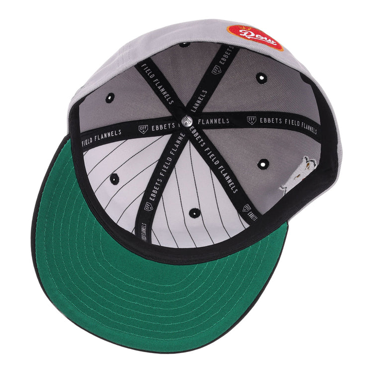 The inside of the EFF Montreal Black Panthers NLB Flip Fitted Ballcap - Gray features a green underbrim, white pinstriped lining, black bands with EBBETS FIELD FLANNELS text, and a red patch with Rosie in white script on top.