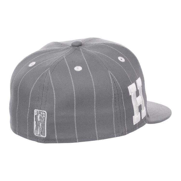 The EFF Homestead Grays NLB Black Pinstripe Fitted Ballcap features black pinstripes, white stitching, a large white H on the side, and a small embroidered batter logo near the back, inspired by the Negro National League team.