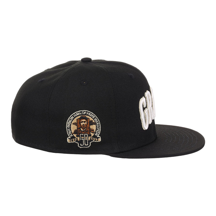 The EFF Homestead Grays Josh Gibson Fitted Ballcap in black features white embroidered lettering, a side patch with Josh Gibson’s portrait, “50,” and “Hall of Fame Induction” in gold and white, making it a true limited edition hat.