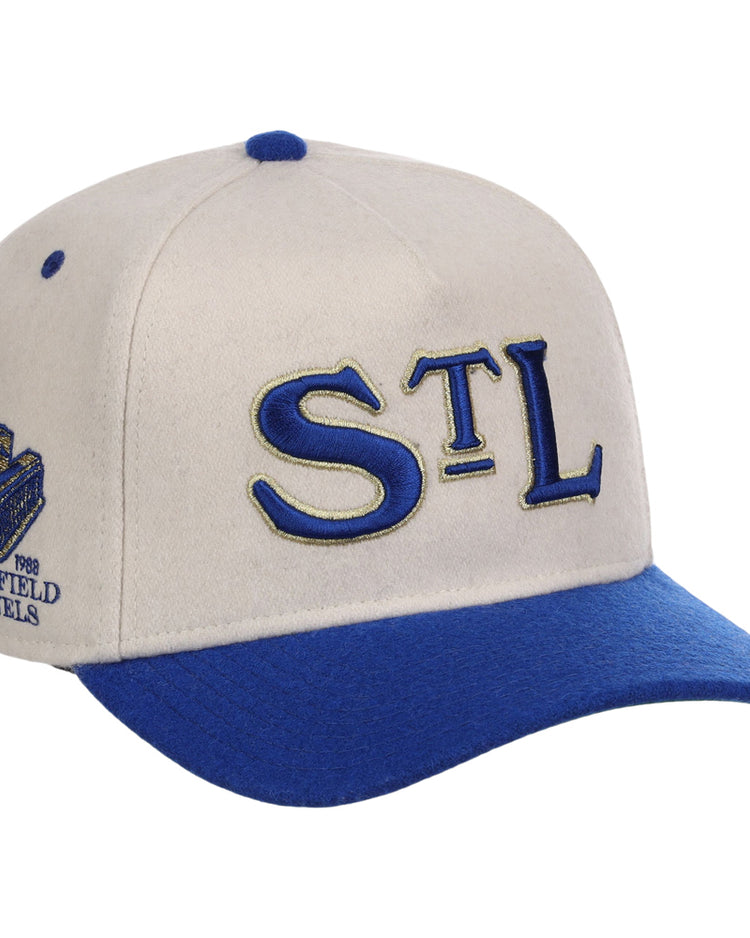 The St. Louis Stars NLB Ballpark A-Frame Ballcap by Ebbets Field features a cream and blue design, STL in blue and gold on the front, a blue bill, and a side patch with Ebbets Field Flannels, stadium logo, and 1988.