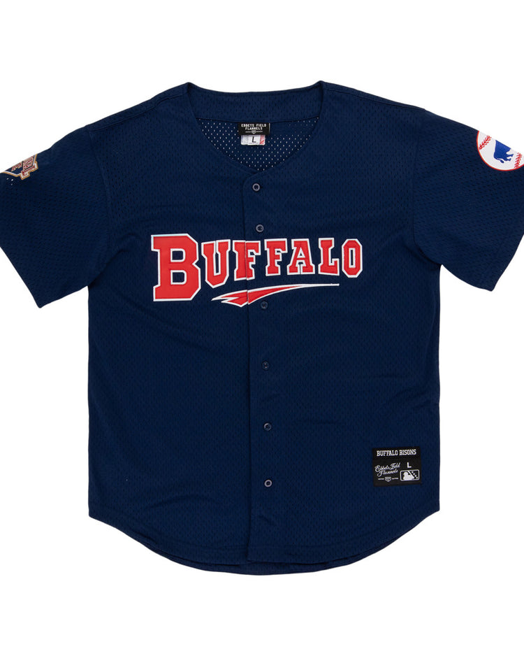 The Ebbets Field Buffalo Bisons MiLB Button Down Jersey features navy blue fabric, BUFFALO in red and white on the front, team patches on both sleeves, and a center button closure.