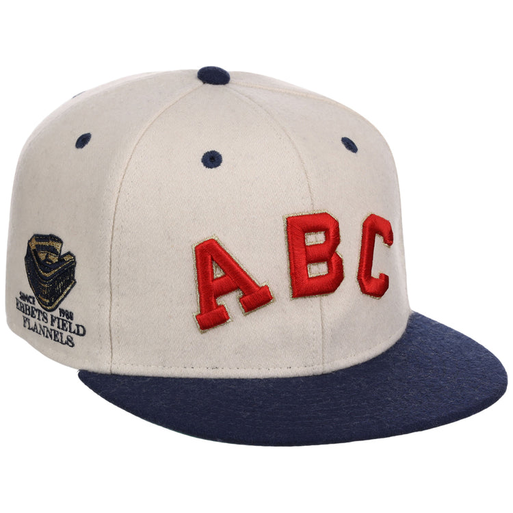 The Atlanta Black Crackers NLB Ballpark Fitted Ballcap by Ebbets Field features a cream crown, navy brim and button, bold red ABC letters on the front, and a gold 