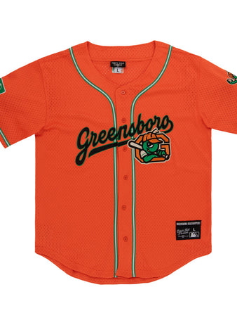 The Ebbets Field Greensboro Grasshoppers MiLB Button Down Jersey features bright orange fabric with green trim, 
