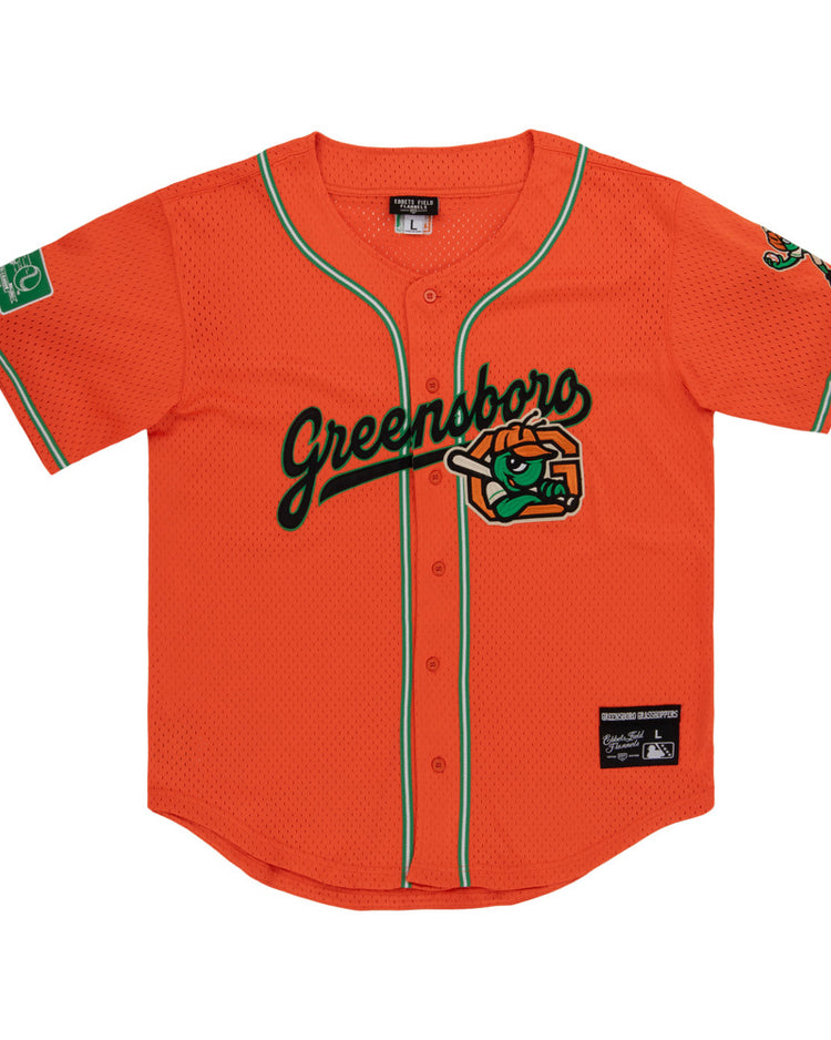 The Ebbets Field Greensboro Grasshoppers MiLB Button Down Jersey features bright orange fabric with green trim, 