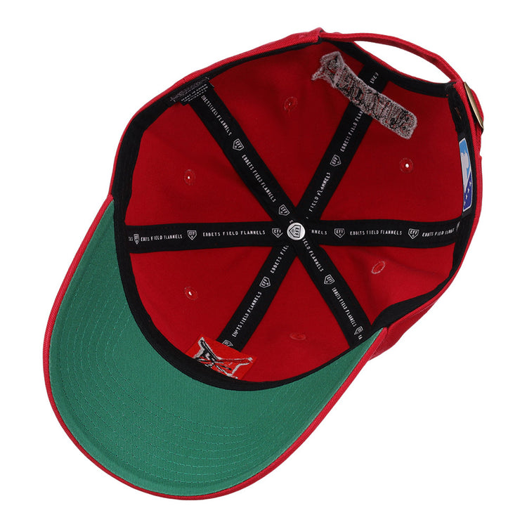 The image shows the inside of the Indianapolis Indians MiLB Dad Ballcap by Ebbets Field, featuring a red exterior, green underbill, black interior taping with white text, adjustable back strap, and visible inner seams and stitching.