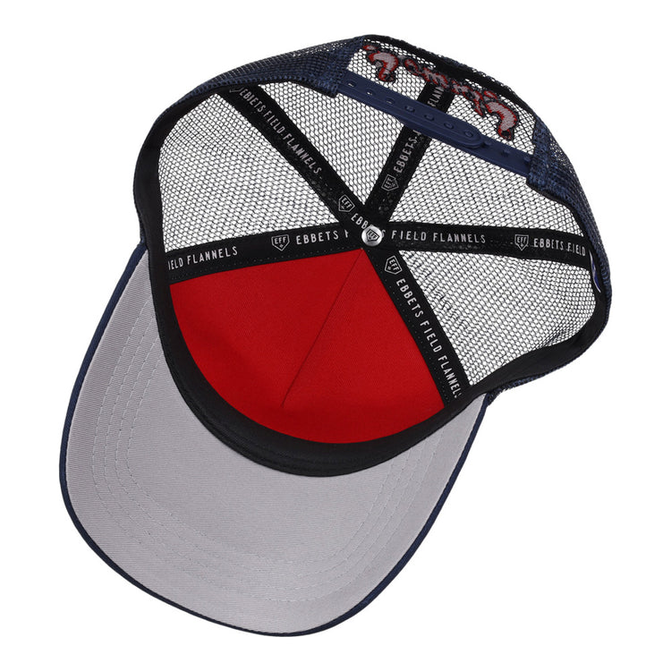 Inside view of the Nashville Sounds MiLB Square Patch Trucker Ballcap by Ebbets Field, featuring a navy brim, red front panel, black inner band with EBBETS FIELD FLANNELS text, and black mesh sides and back.