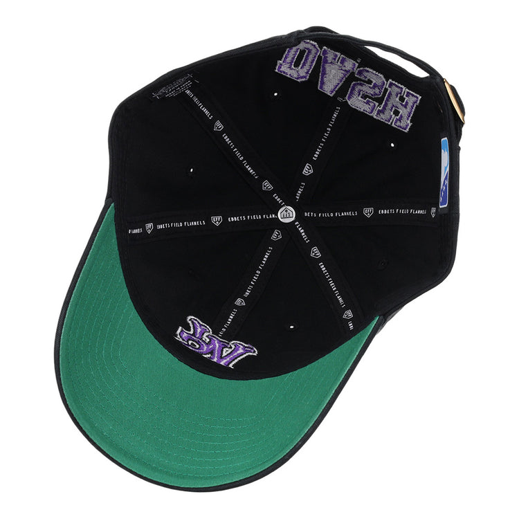 The Winston-Salem Dash MiLB Dad Ballcap by Ebbets Field is shown inside-out, featuring a green underbill, purple “LA” embroidery near the brim, and white text plus logos along the inner seams.