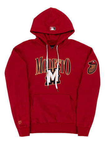 The Ebbets Field Modesto Nuts MiLB Cotton Hooded Sweatshirt is a red hoodie with MODESTO and a large gold and white M on the front, a red bird head patch on the left sleeve, and an MLB logo on the hood.