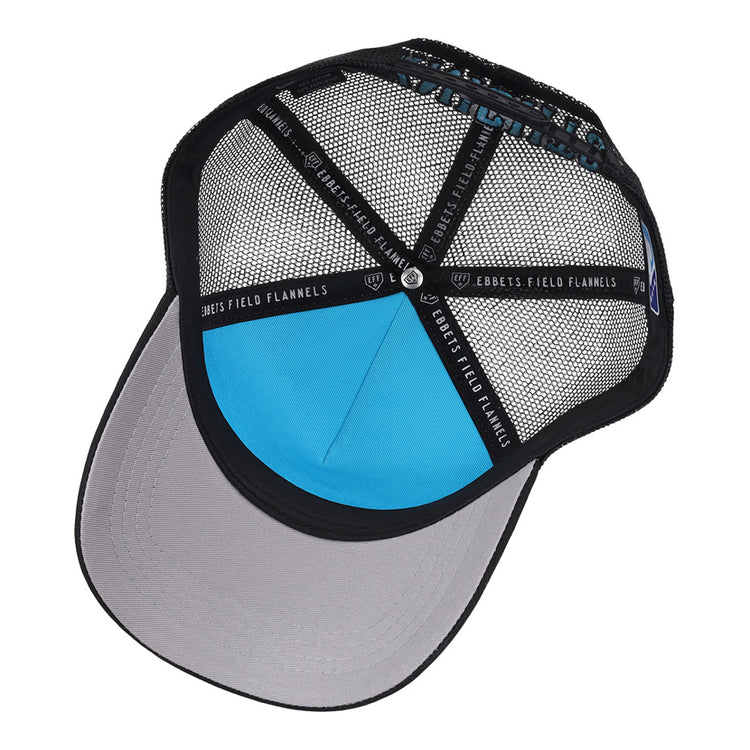A look inside the Charlotte Knights MiLB Trucker Ballcap by Ebbets Field, featuring a black mesh design, gray brim, blue inner panel, and black support bands labeled EBBETS FIELD.