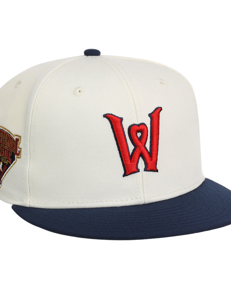 The Ebbets Field Worcester Red Sox MiLB Snapback Ballcap is a white cap with a navy blue brim, red W logo on the front, and a commemorative patch on the left side.